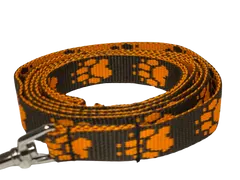 Palkar Vodítko z popruhu pro psy 150 cm x 20 mm hnědo-oranžová s tlapkami