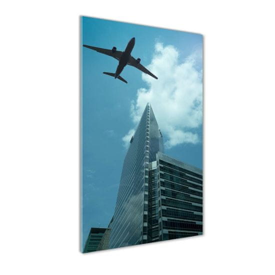 Wallmuralia Vertikální Fotoobraz na skle Letadlo nad městem 4 úchytky